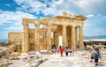 People visit the Ancient Greek Propylaea on the Acropolis of Athens, Greece